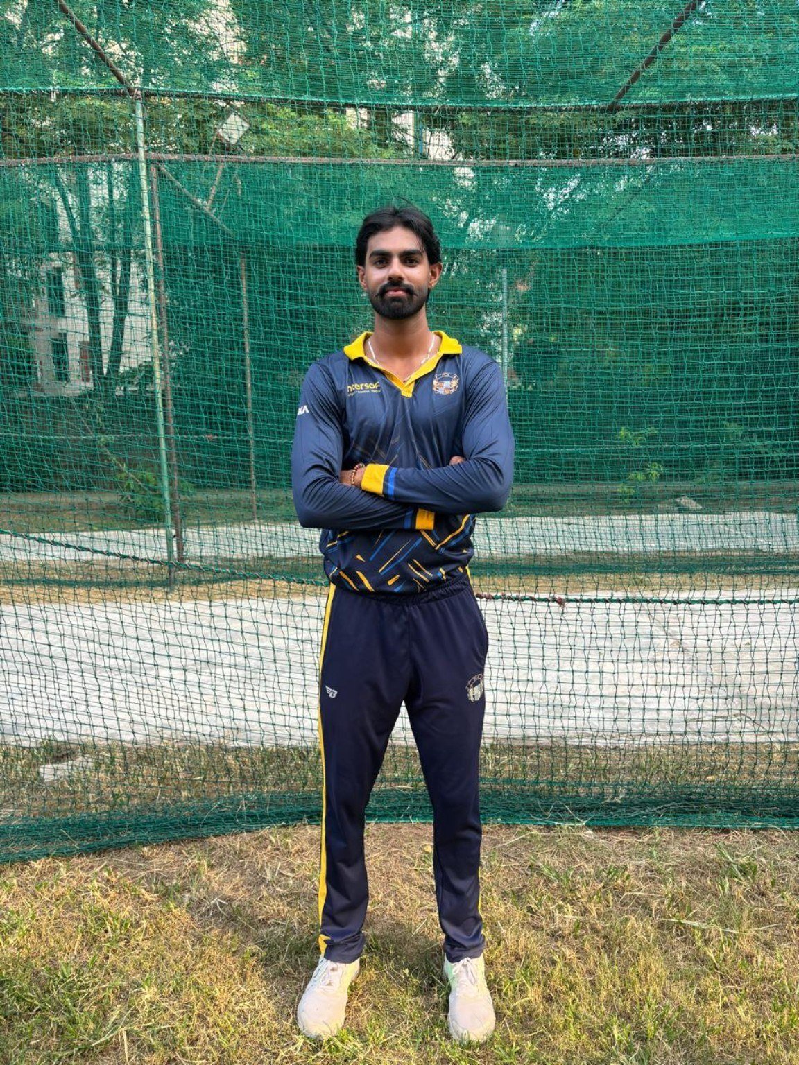Cricket player in academy kit