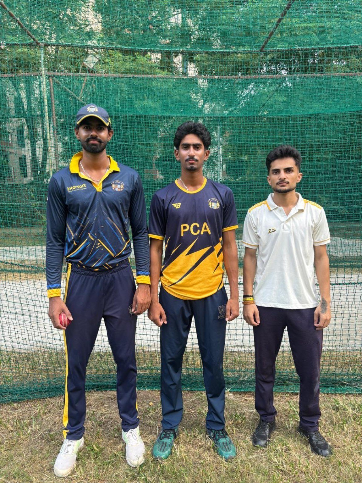 Cricket players together at nets