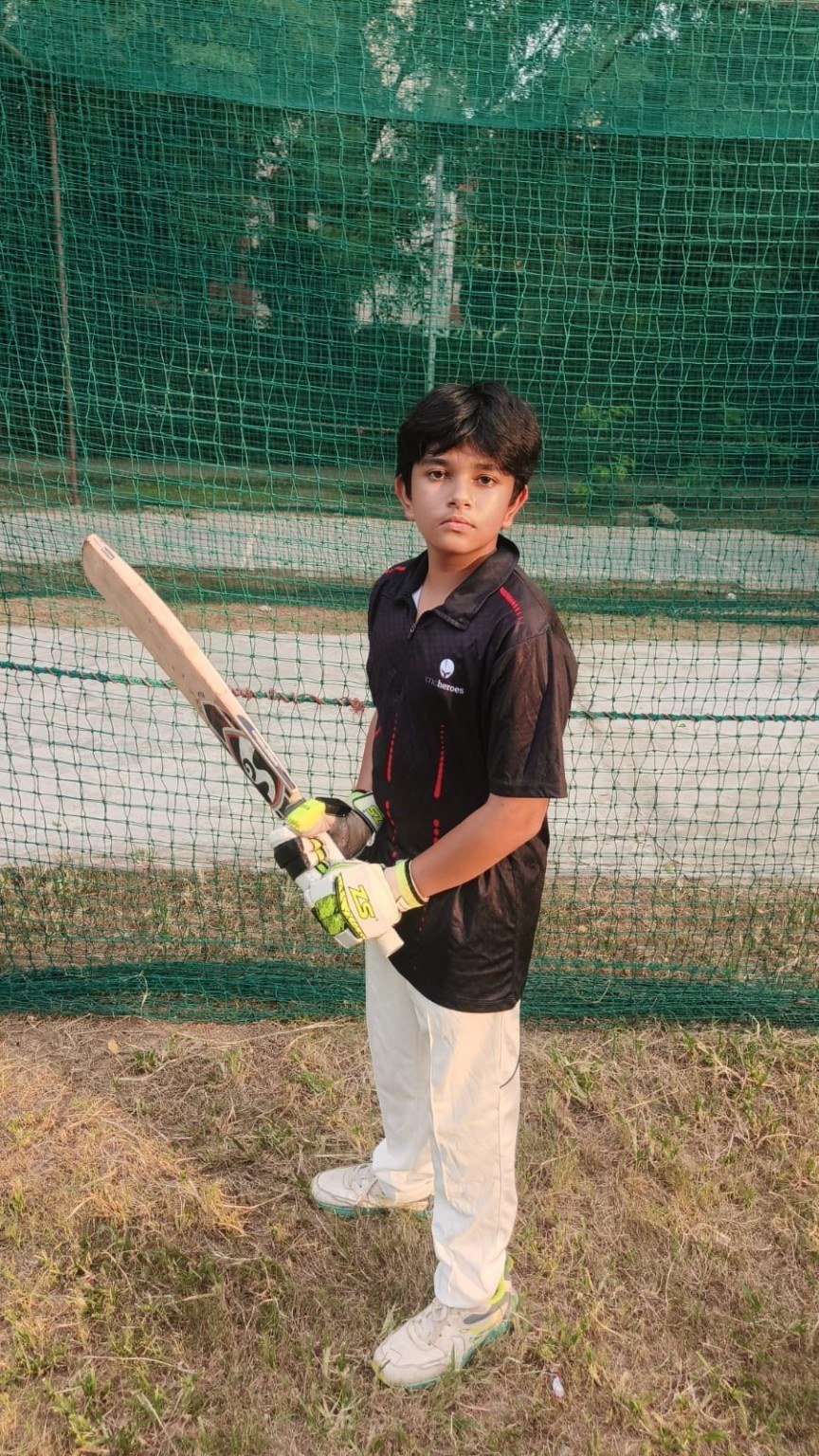 Young batter with cricket bat